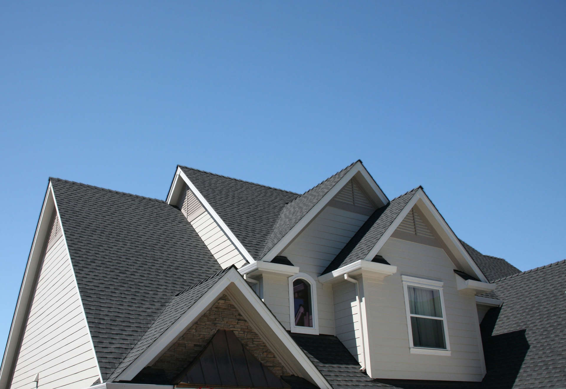 roof peaks of a house representing the reasons to take out a home equity loan and how it could benefit you
