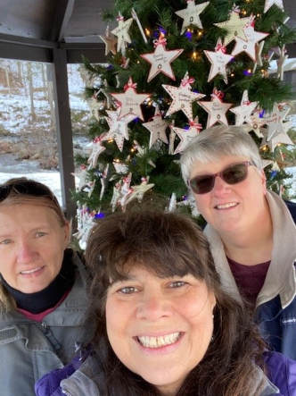 group photo of employee volunteers participating in decorating for the Lake Luzerne Memory Christmas Tree