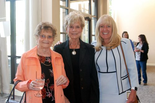 photo from an HRCCU Annual Meeting of two women smiling with CEO Sue Commanda