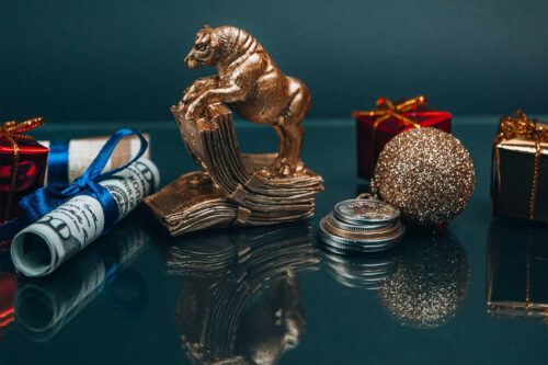 Christmas and New Year’s holiday décor next to money saved for the new year