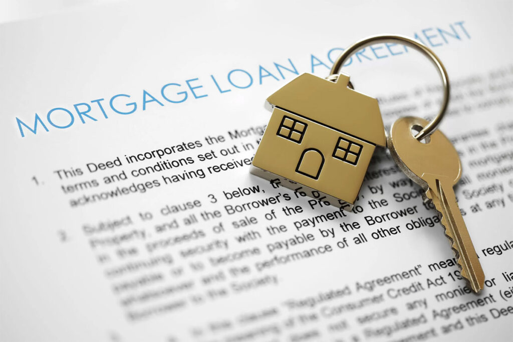 mortgage loan papers with a set of keys on top