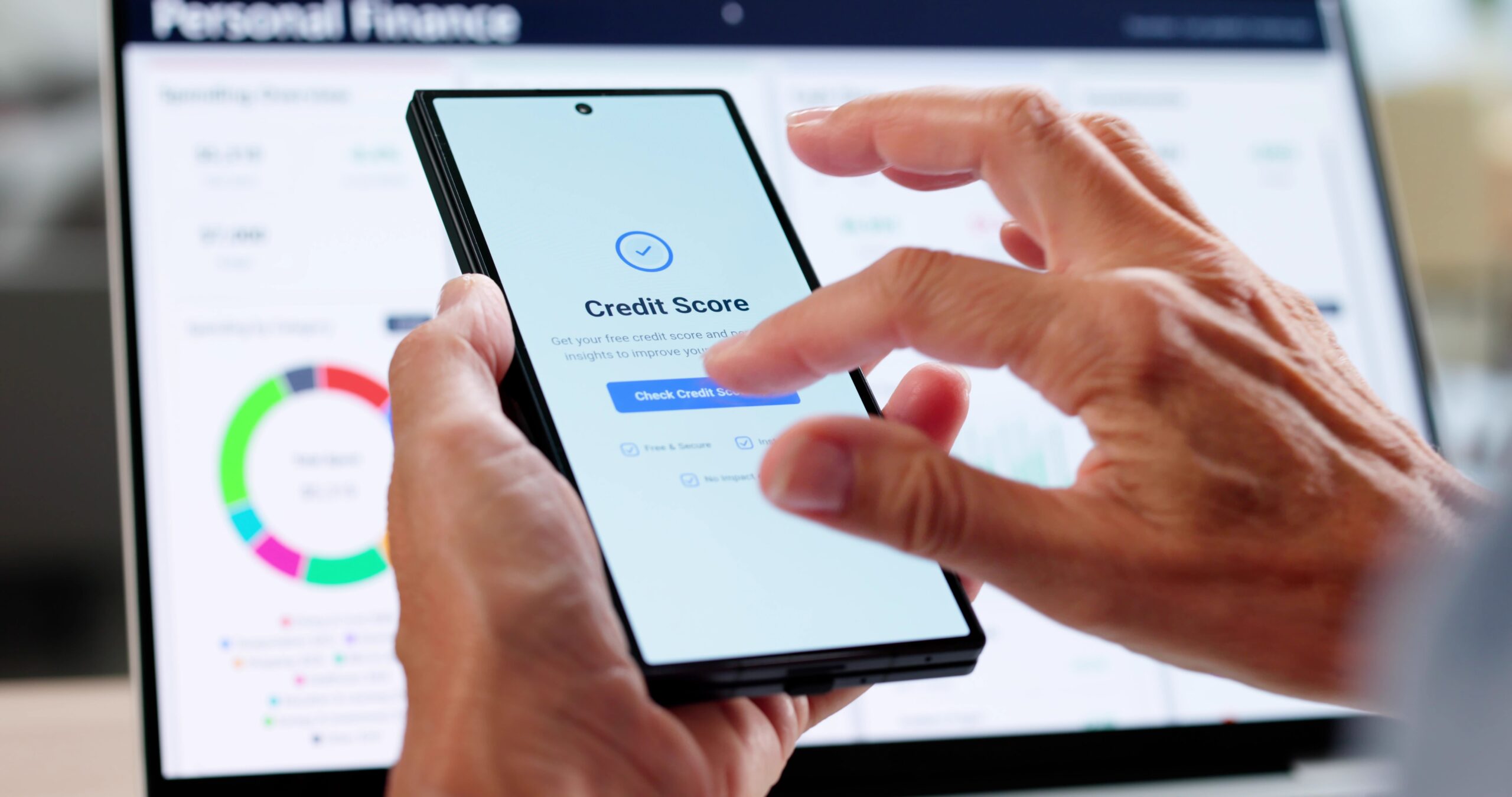 A man logs into his personal finance account to check his credit score.